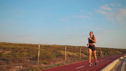 Woman Running Racetrack on Nature Summer Morning