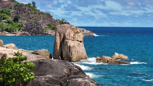 Rocky Coastline with Large Boulder and Ocean Waves Seychelles Mahe