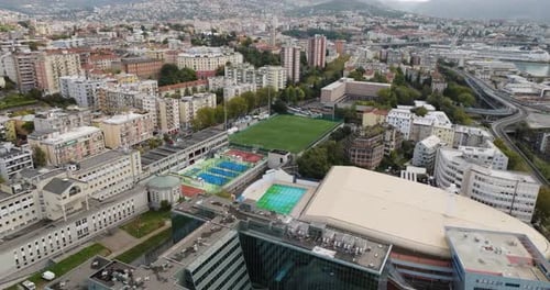 Aerial view of sports facilities and city, Italy.