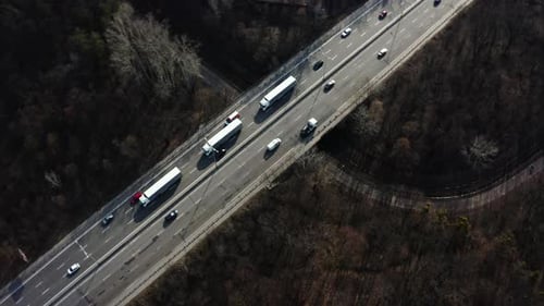 Road transport truck industry. highway top view follow vehicle aerial footage.