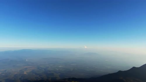 Aerial View of Nevado de Colima's Majestic Peaks Under Clear Blue Sky