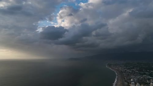 Aerial View Flying Through Thunderclouds at Sunset