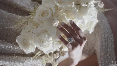 Woman's Hand Holds White Rose Bouquet, Diamond Ring