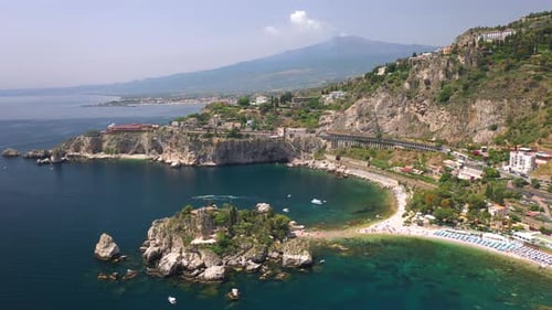 Drone shot of the Isola Bella coastline and the Ionian Sea. Near Taormina, Sicily, southern Italy. W