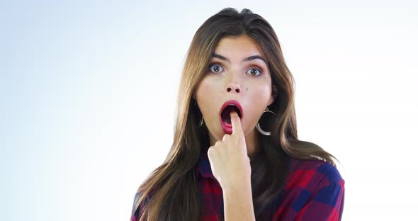 4k video footage of a young woman sticking her finger down her throat