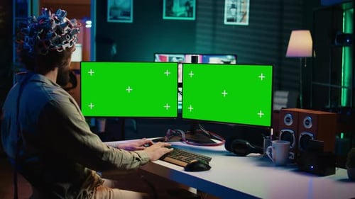 Computer Engineer Starting Mind Upload Process Using Green Screen PC