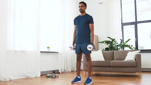 Fitness, Sport, Weightlifting and Bodybuilding Concept - Indian Man Exercising with Dumbbells