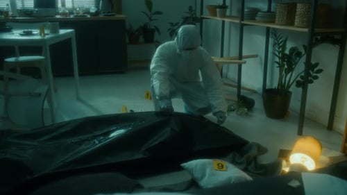 Investigator Examines Body at a Crime Scene