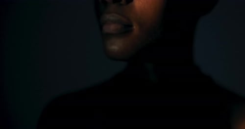 Dramatic Portrait of a Young Adult in Shadow