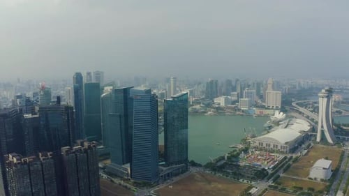 Drone Aerial view 4k Footage Of Singapore Skyscrapers With City. Corporate Offices Singapore.