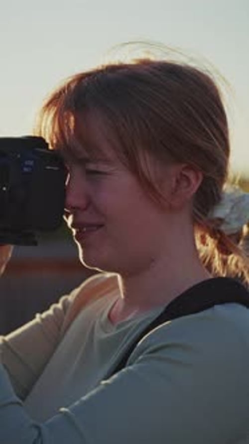 Woman Takes Photos With a DSLR Camera