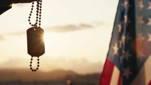Dog Tags and American Flag at Sunset