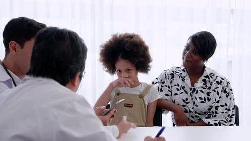 Child Patient Speaking With Medical Professionals