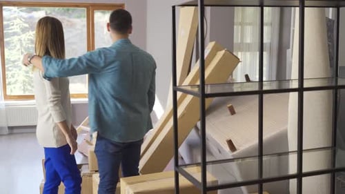 Happy couple moving into their new home.