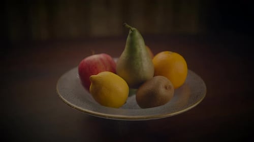 Fresh Fruit in a Bowl on a Dark Table