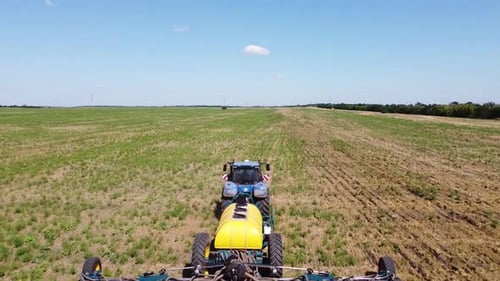 Blue Tractor O.A. Planting Canola On No Till Field