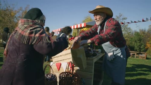 Elderly Woman Shopping at Farmers Market