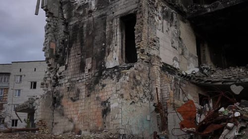 Panning Left to Right Along Demolished Ruined Bombed Residential Building in Kyiv Ukraine