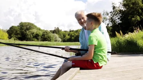Family, Generation, Summer Holidays and People Concept - Happy Grandfather and Grandson