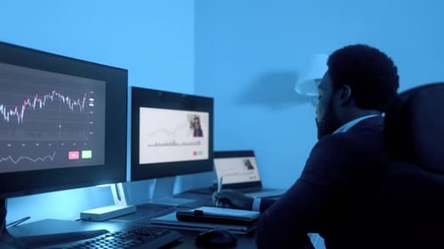 Business financial investor making stock market analysis video call inside office at night -