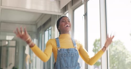 Woman Celebrates Job Success Tossing Papers in Office