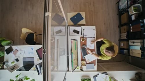 Business Employee Facing Stress at Desk Full of Documents