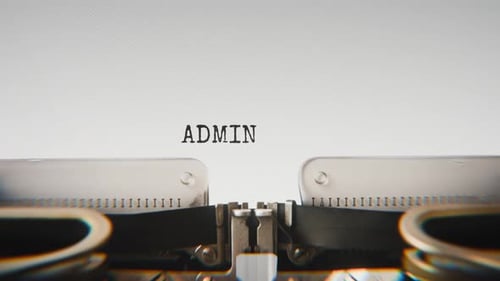 Old mechanical typewriter typing Administration in a close-up view.