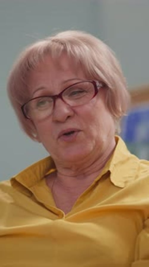 Senior Woman Talking in a Hospital Close Up