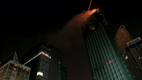A fire breaks out in a high-rise skyscraper office building under construction in Hong Kong.