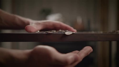 Hands Skillfully Balancing Various Objects on a Beautiful Wooden Surface Setting