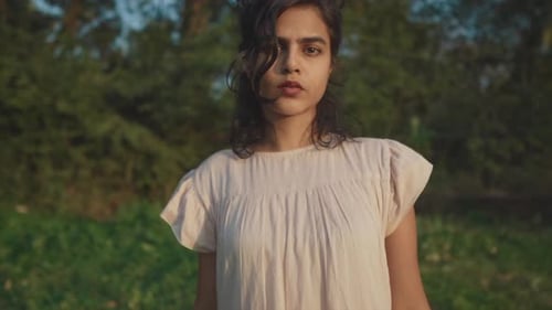 Woman in Dress Standing in Natural Light