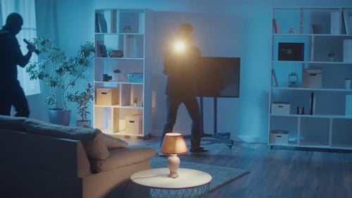 Burglars Breaking into House at Night