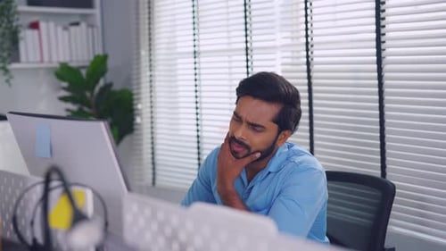 Depression Asian businessman worker work on table in office workplace.
