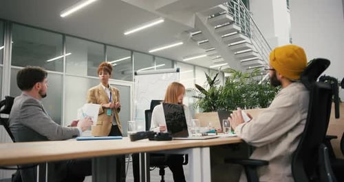 Black Businesswoman Conducts Presentation in Modern Office