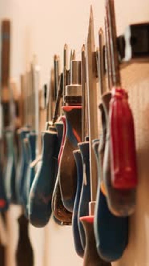 Vertical Video Close Up of Various Woodworking Tools on Rack Panning Shot