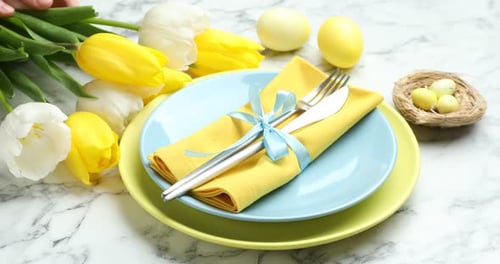 Easter Table Setting with Tulips, Eggs and Plates