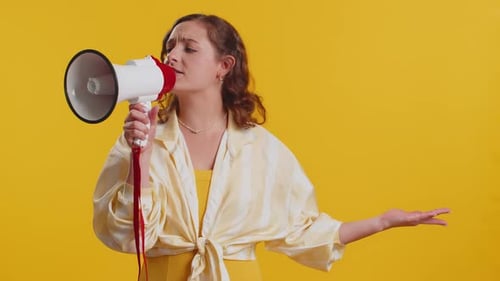 Woman Talking with Megaphone Proclaiming News Loudly Announcing Advertisement Pointing Empty Place