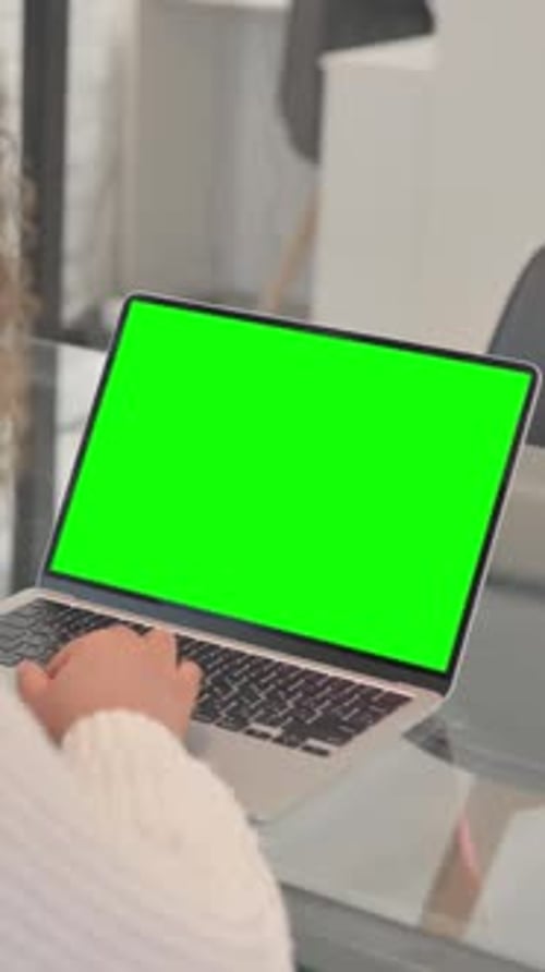 African Woman Using Laptop with Green Screen, Vertical Video