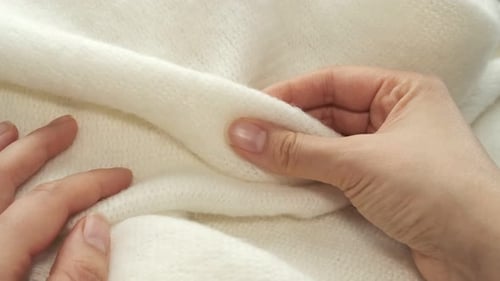 Hands Touch Soft White Knitted Wool Material