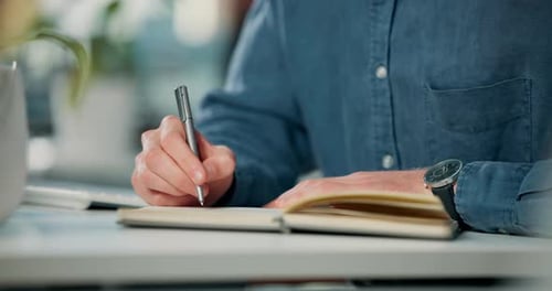 Person, pen and writing in book on table for work, planning schedule or business appointment