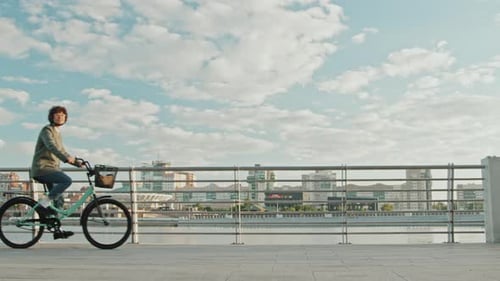Modern Female Manager Cycling in Morning