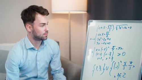 Man Teaching a Math Lesson at Home