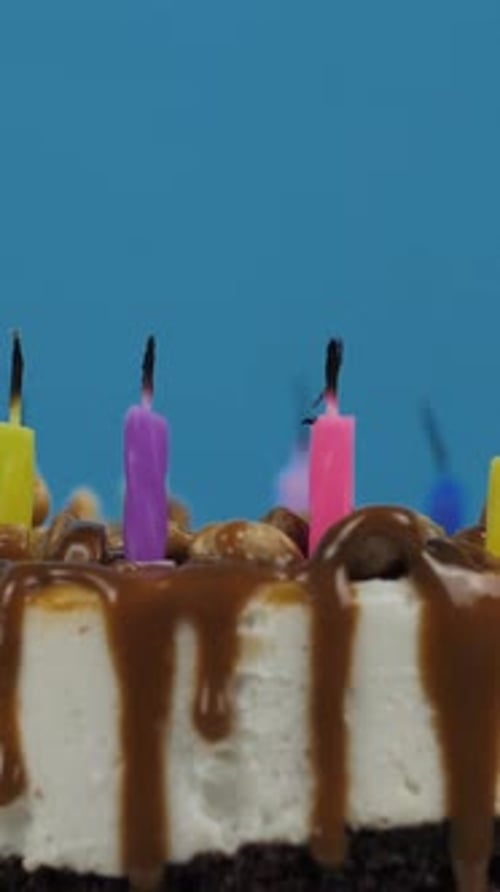 birthday cake with candles on a blue background
