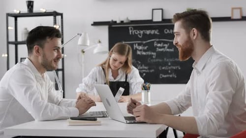 Young entrepreneurs brainstorm finance solution in modern loft studio workplace