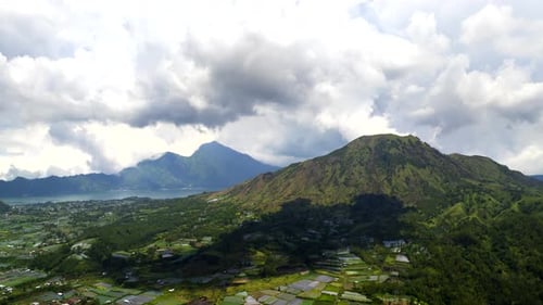 Aerial hyperlapse view of moving cloudscape over Mount Batur, Bali, Indonesia