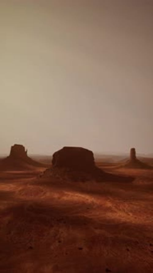 Arid Desert Landscape With Distant Rocks