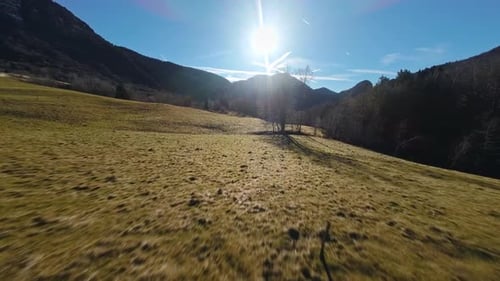 Aerial view of a mountain behind a mountain forest