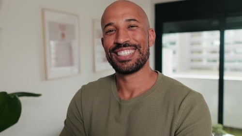Smiling Man with Olive Shirt Inside Apartment