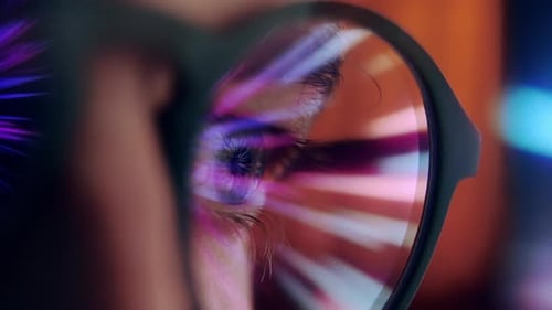 Reflections in Glasses: Close-up of Eye and Technology