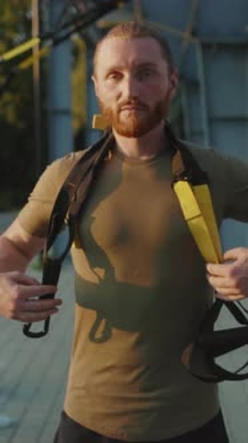 Fit Young Adult with Suspension Straps Outdoors